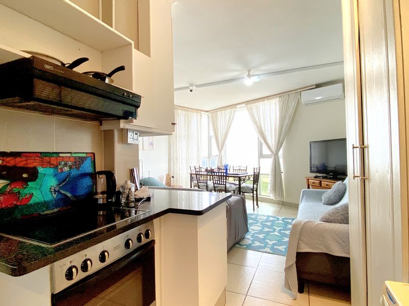 Beachfront Bliss with 2 Bedrooms Fully Furnished Coastal Luxury - Photo 3