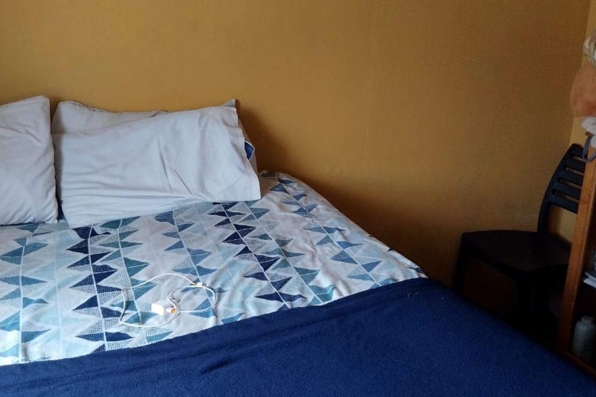 A bedroom featuring yellow walls and a standard layout, suitable for personalizing with updated finishes and decor.