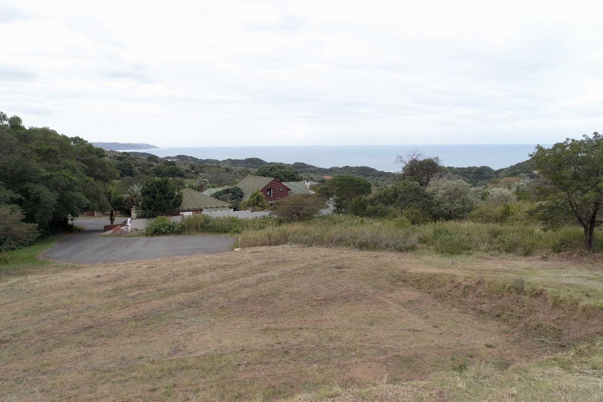 A view of the vacant residential land overlooking the surrounding coastal landscape and nearby neighborhood.