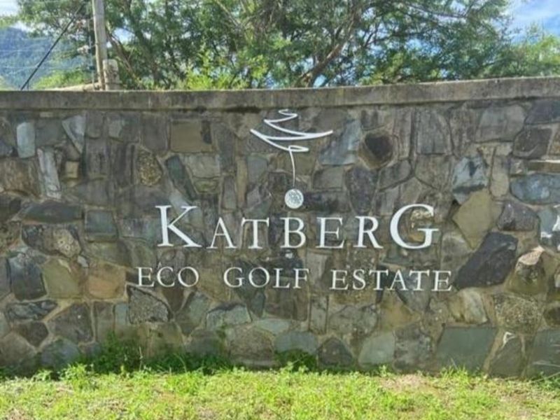 Entrance signage for Katberg Eco Golf Estate featuring a decorative stone boundary wall.