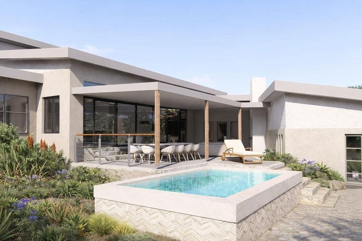 A modern rear exterior view featuring a covered patio, a raised swimming pool with decorative stone tiling, and landscaped garden surroundings.