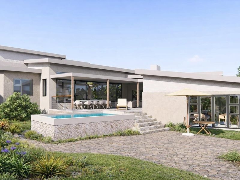 Rear view of a modern residential property featuring a raised swimming pool, stone-paved patio, covered outdoor entertainment area, and landscaped garden.