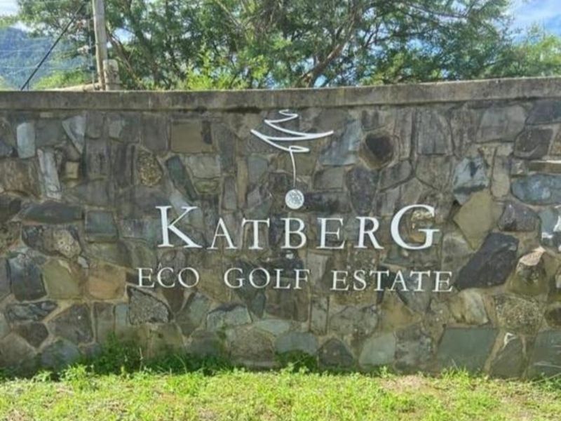Entrance signage for Katberg Eco Golf Estate featuring a decorative stone masonry wall.