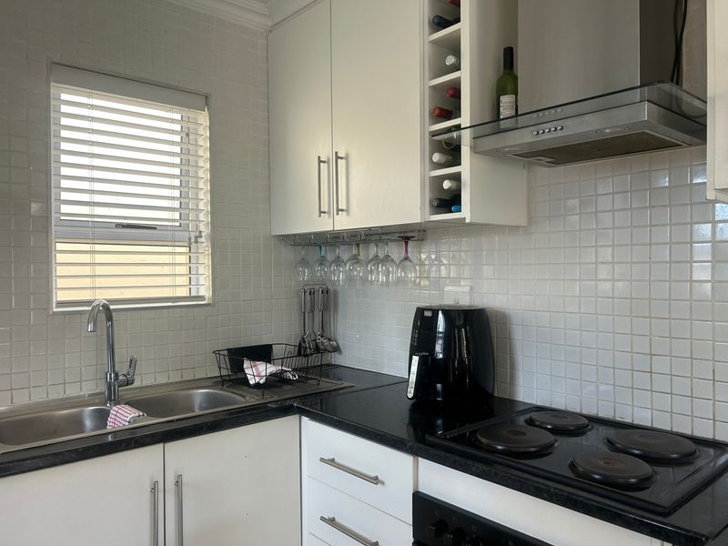 Move-in ready | Lock-up-and-go | Secure complex | Close to amenities - Photo 5