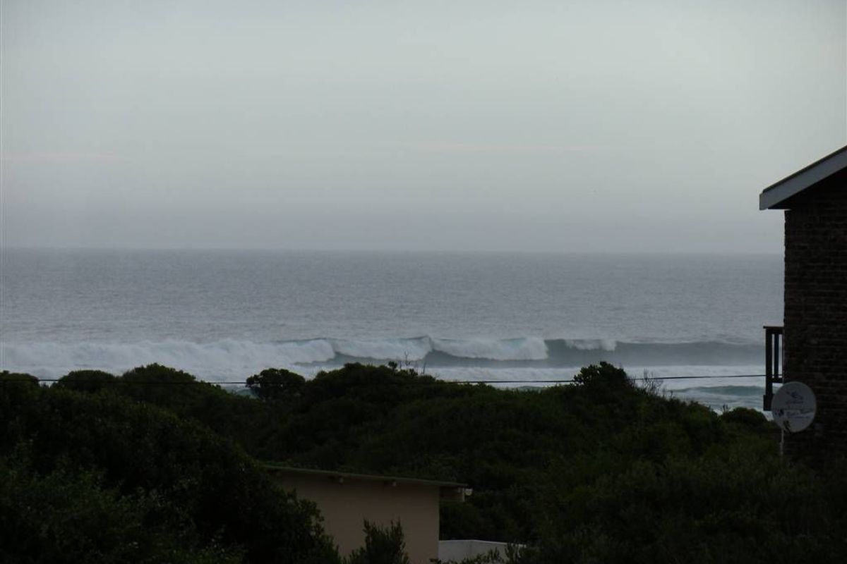 A scenic view of the ocean waves and coastal landscape from the property.