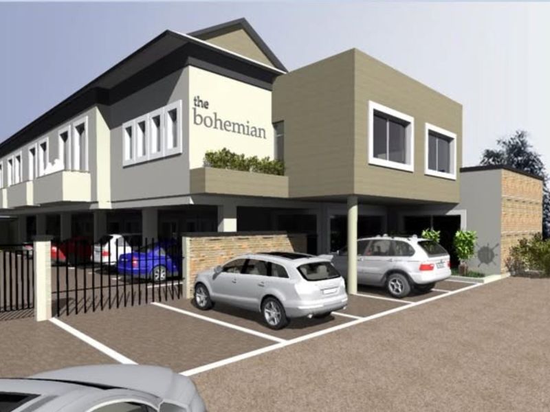 An artist impression of the exterior front facade of The Bohemian office building, featuring modern architecture and dedicated paved parking bays.