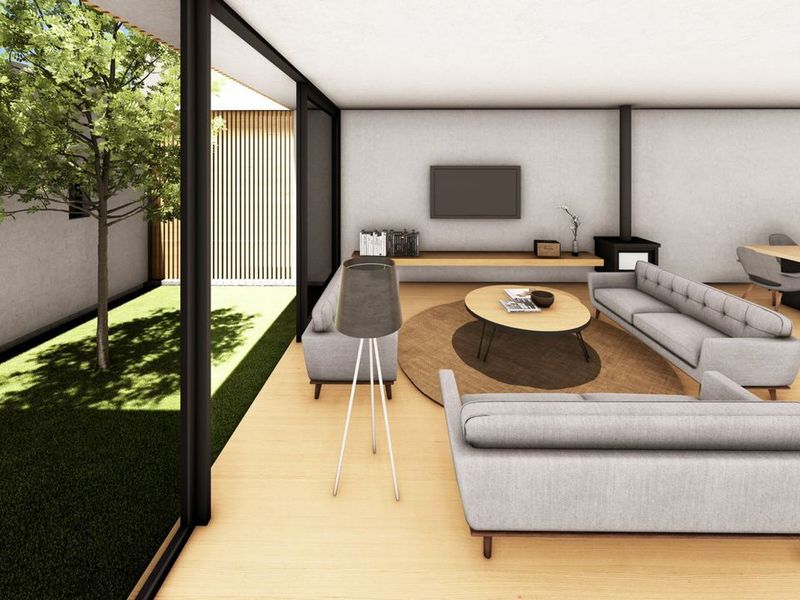 Modern open-plan living and dining area featuring large sliding glass doors opening to a private garden, hardwood floors, and a built-in fireplace.