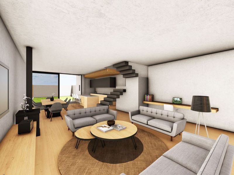 Modern open-plan living area featuring a floating staircase, wood-burning fireplace, and a sleek kitchen with an island, flowing seamlessly to the outdoor patio.