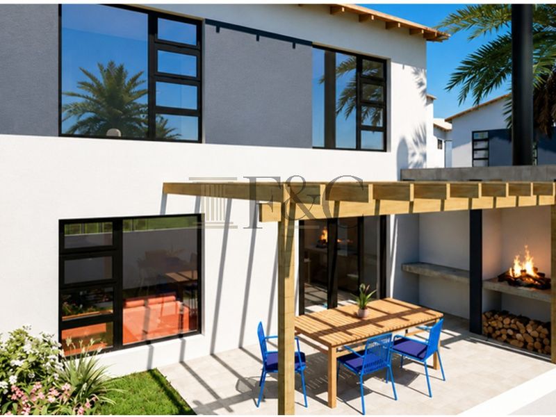 Rear exterior view of a modern townhouse featuring a timber pergola, built-in braai area, and a paved patio overlooking a small garden.