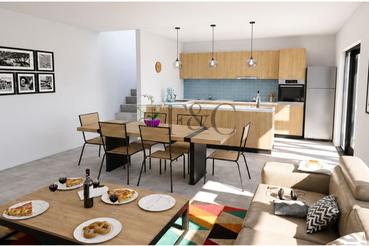 Modern open-plan living and dining area featuring a contemporary kitchen with light wood cabinetry, integrated appliances, and a functional kitchen island.