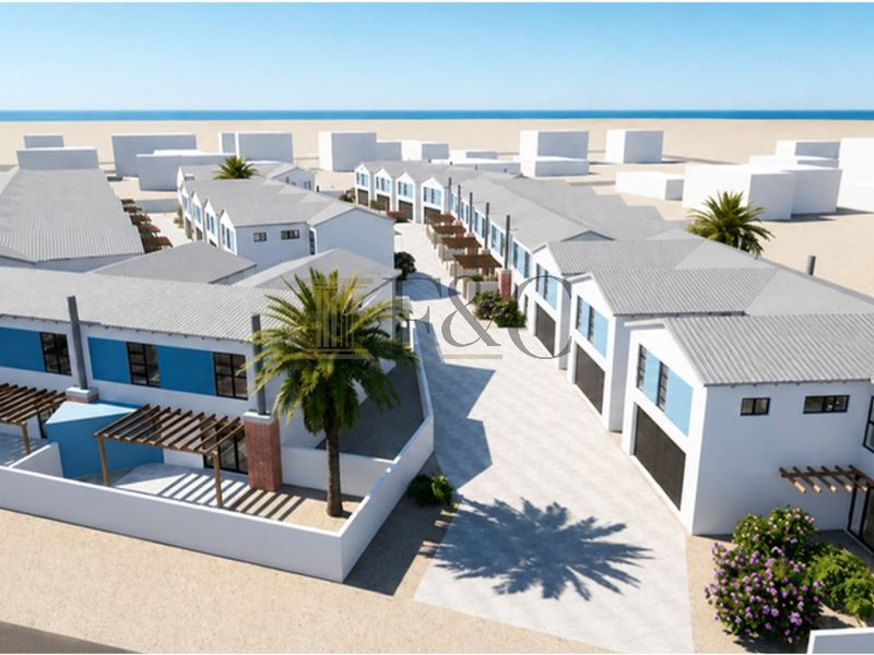 Aerial perspective of a modern townhouse development featuring uniform architectural design, paved access roads, and private outdoor pergola areas.