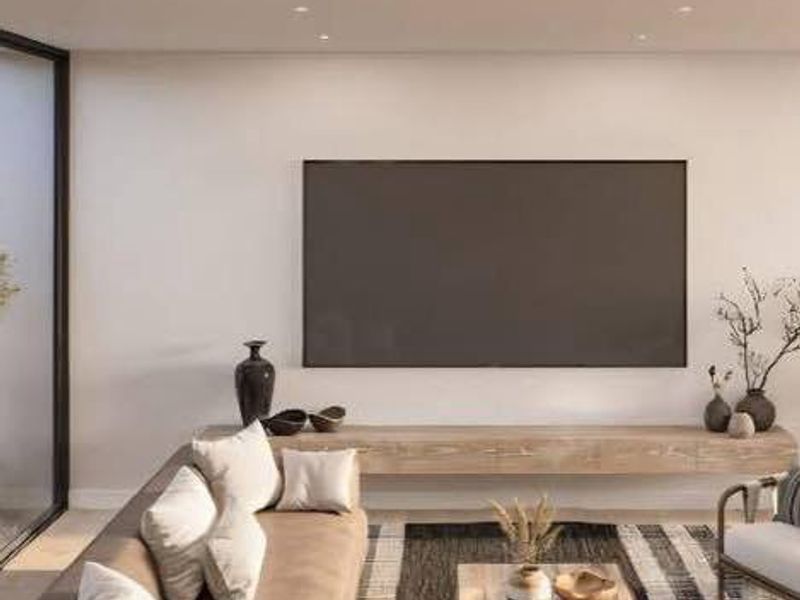 Modern living room featuring recessed downlights, a sleek floating timber media console, and large sliding glass doors providing natural light.