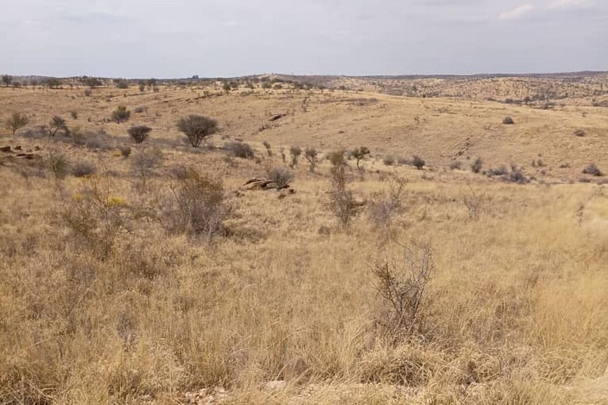 A wide-angle view of the expansive, dry, and undeveloped residential land featuring natural veld vegetation and rolling terrain.