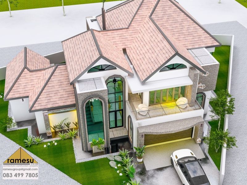 An aerial perspective of a modern residential property design featuring a tiled roof, stone accents, a balcony, and a double garage.