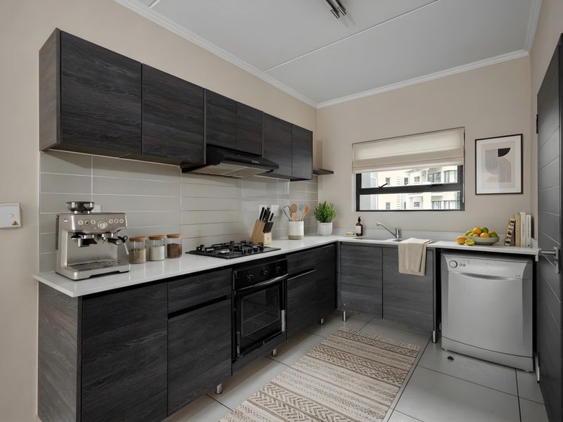 Modern kitchen featuring dark wood grain cabinetry, white stone countertops, built-in gas hob, oven, and integrated sink with tiled backsplash and flooring.