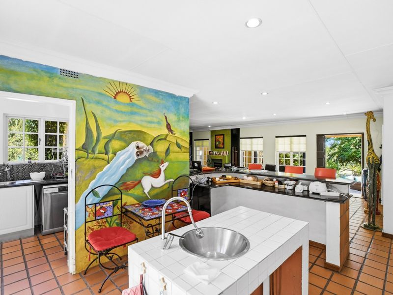 Located in Chartwell North, this property offers a 4-bedroom - Photo 3