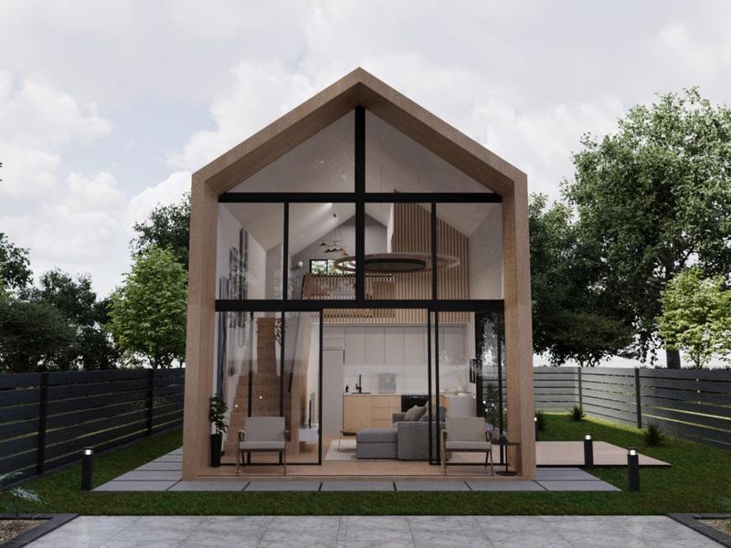 A modern townhouse rear elevation featuring a striking floor-to-ceiling glass facade, timber frame construction, and a private garden with paved patio area.