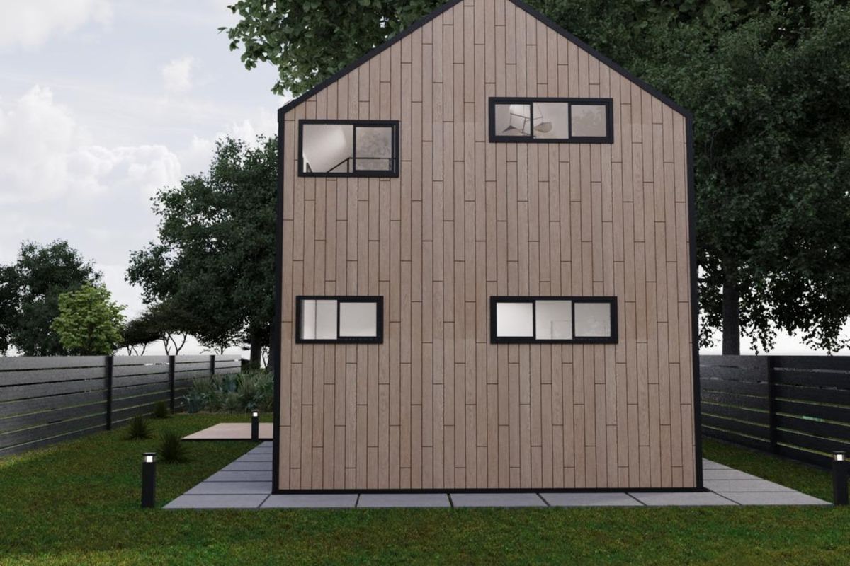 Rear view of a modern townhouse featuring timber cladding, black-framed windows, and a landscaped garden with paved patio area.