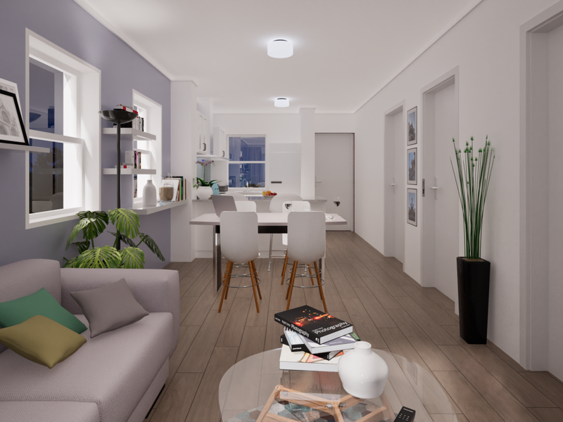 A modern open-plan living and kitchen area featuring neutral tones, recessed lighting, and wood-look flooring, creating a bright and cohesive living space.