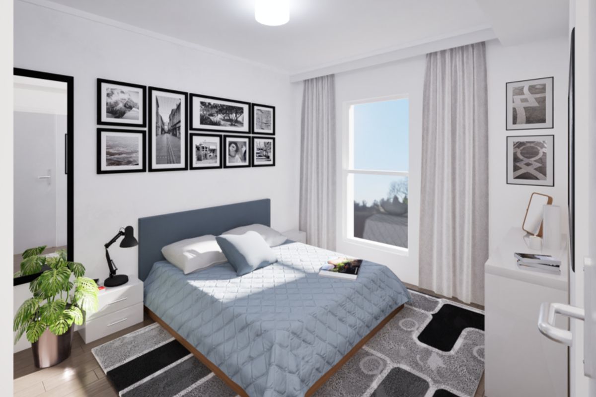 A bright and modern bedroom featuring laminate flooring, a large window with curtains, and a clean, neutral aesthetic.