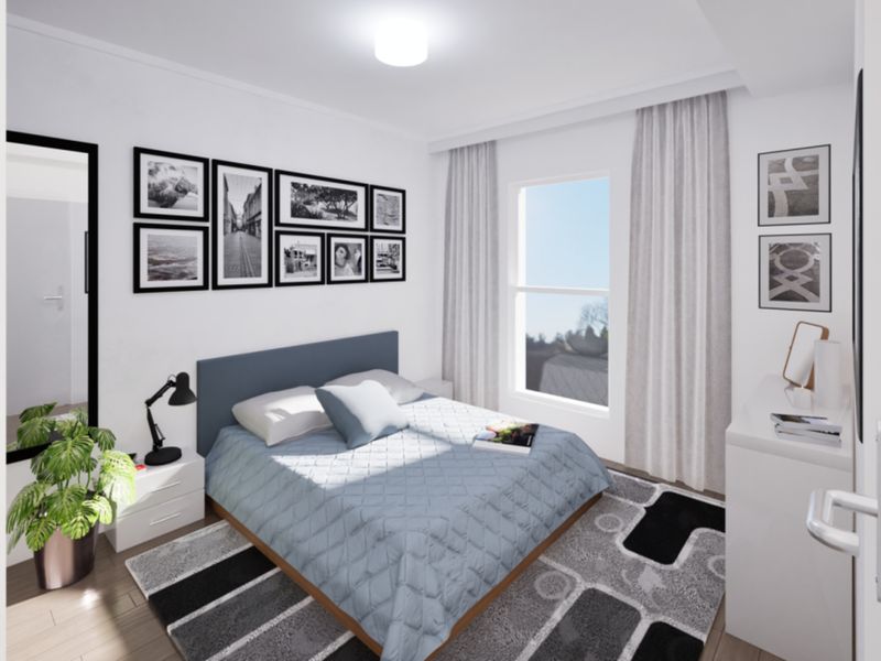 A bright and modern bedroom featuring laminate flooring, a large window with curtains, and a clean, neutral aesthetic.