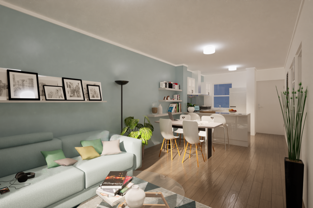 A modern open-plan living and kitchen area featuring laminate flooring, neutral wall tones, and a functional kitchen island with integrated cabinetry.