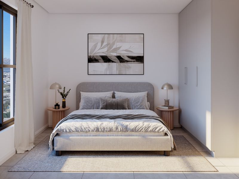 A modern, well-lit bedroom featuring built-in cupboards, neutral finishes, and a large window offering natural light and scenic views.