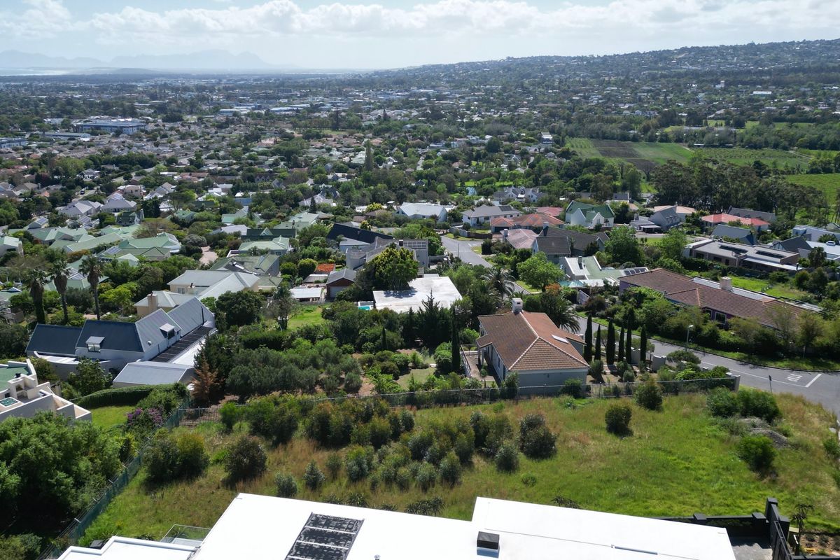 Aerial view of a residential area showcasing the surrounding neighborhood landscape and property positioning.