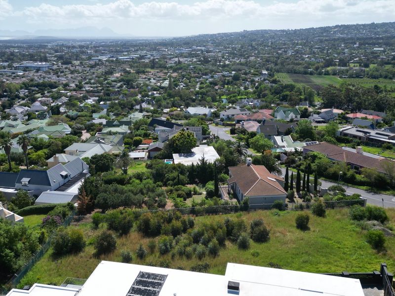 Aerial view of a residential area showcasing the surrounding neighborhood landscape and property positioning.