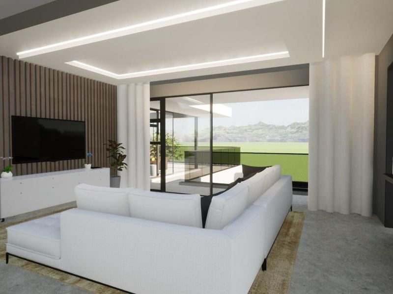 Modern living room featuring timber slat wall paneling, recessed ceiling lighting, concrete flooring, and large sliding glass doors opening to an outdoor area.