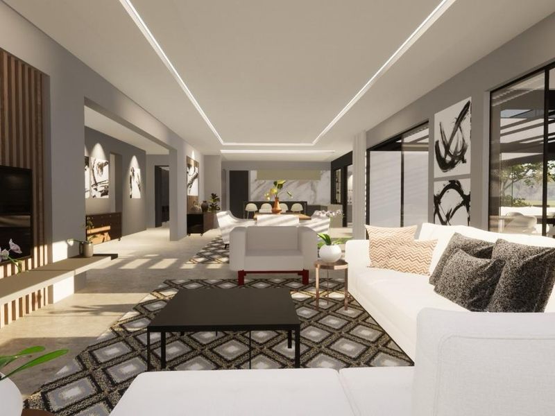 Spacious open-plan living area featuring modern recessed ceiling lighting, timber slat wall detailing, and large sliding glass doors leading to an outdoor patio.