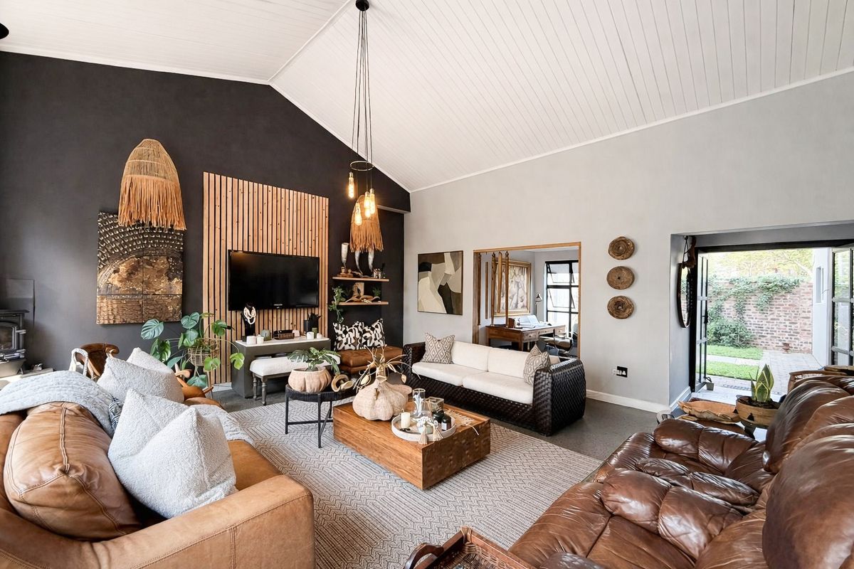 Spacious living room featuring a vaulted tongue and groove ceiling, timber slat feature wall, and direct access to the rear garden.