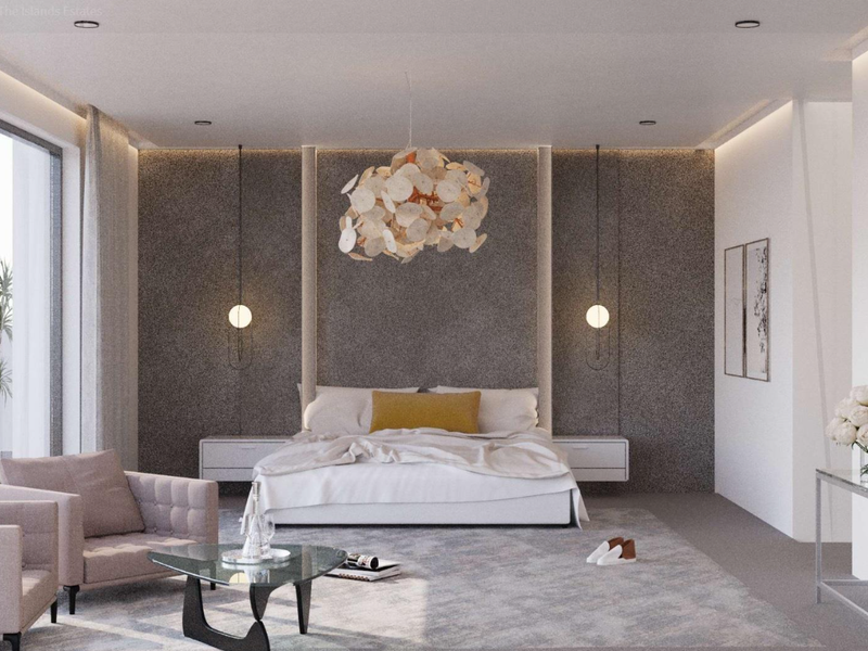 A modern, well-appointed bedroom featuring a textured feature wall, recessed lighting, and large sliding glass doors providing access to an outdoor area.