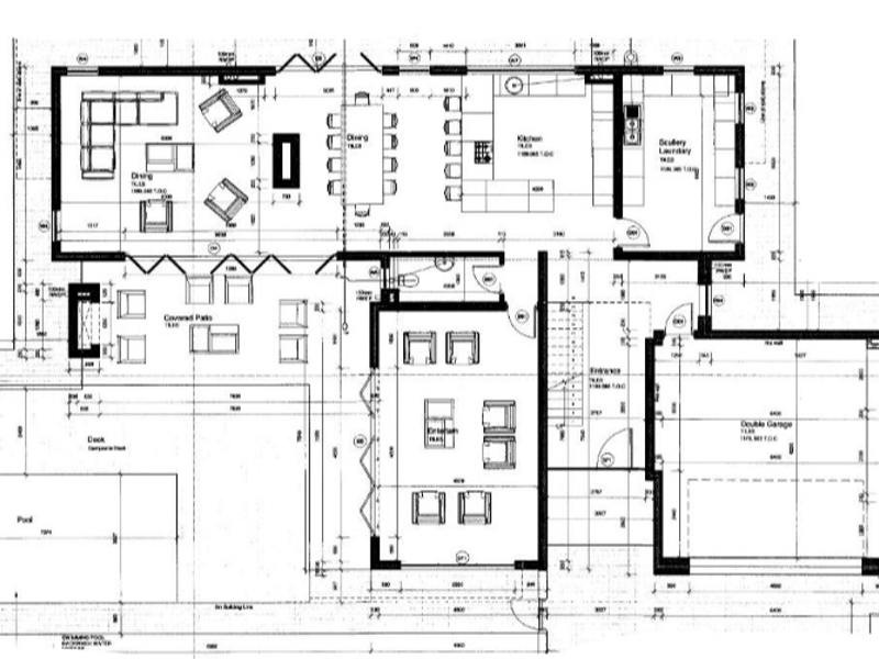 Architectural floor plan showing the layout of the residence, including living areas, kitchen, scullery, garage, and outdoor pool deck.