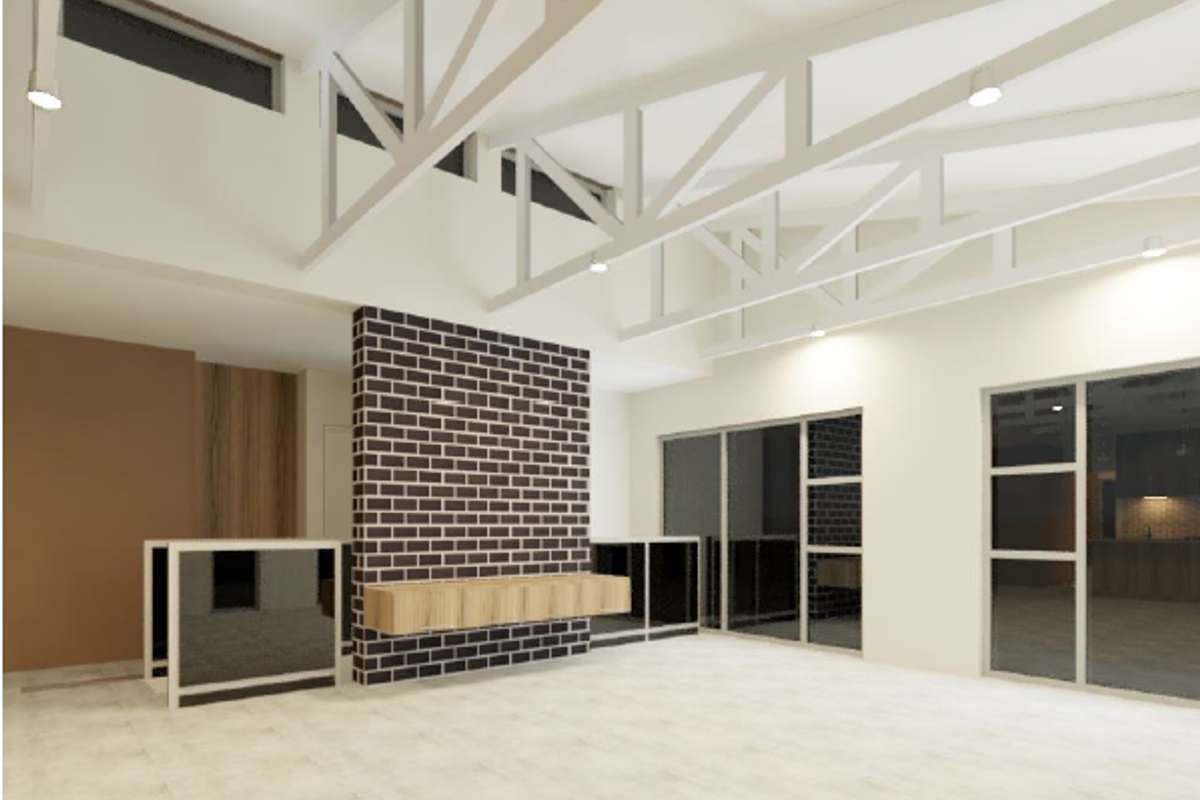 Spacious open-plan living area featuring exposed white roof trusses, a striking brick feature wall with a floating cabinet, and large glass sliding doors.