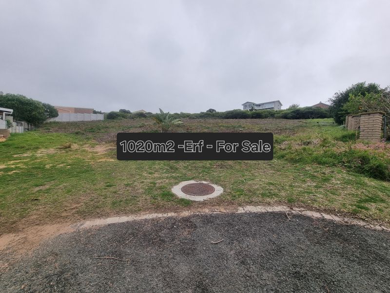 A vacant 1020m2 residential erf featuring a gentle slope, established boundary walls, and direct street access.