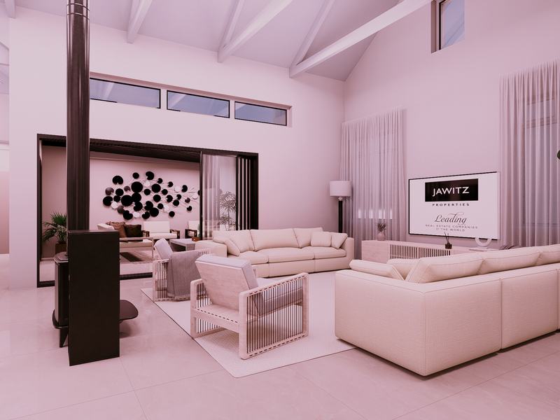 Spacious living room featuring a vaulted ceiling with exposed rafters, a modern freestanding fireplace, and large sliding glass doors opening to an outdoor area.