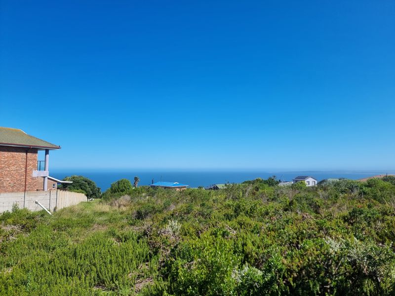 A scenic view of the coastline and ocean from the vacant residential property, showcasing the elevated position and surrounding landscape.