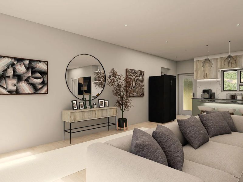 Modern open-plan living area featuring a contemporary kitchen with stone countertops, island seating, and recessed lighting, seamlessly integrated with the lounge space.