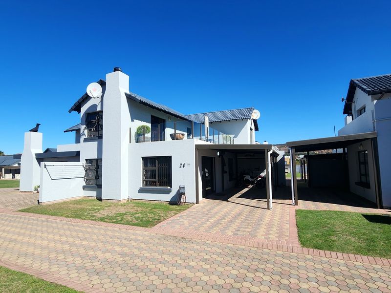 Coastal Comfort, Secure Living, and Excellent Rental Potential - Photo 1