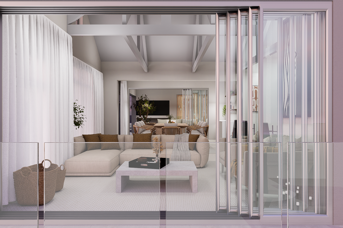 Spacious living area featuring vaulted ceilings with exposed trusses, seamlessly connected to the outdoors through large glass sliding doors and a modern glass balustrade.