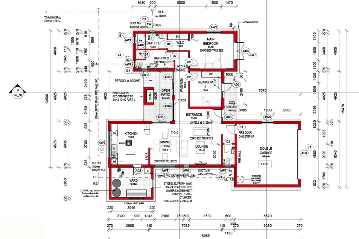 Architectural floor plan detailing the layout of a residential house, including bedrooms, bathrooms, kitchen, living areas, and a double garage.
