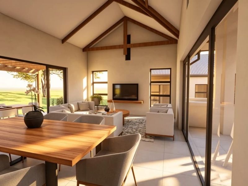 Spacious open-plan living and dining area featuring a high vaulted ceiling with exposed timber trusses and large sliding glass doors opening to the outdoors.