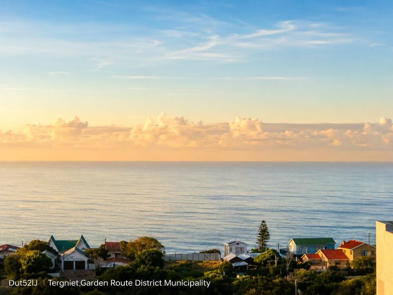 A scenic coastal view overlooking the ocean and residential properties in Tergniet, Garden Route District Municipality.