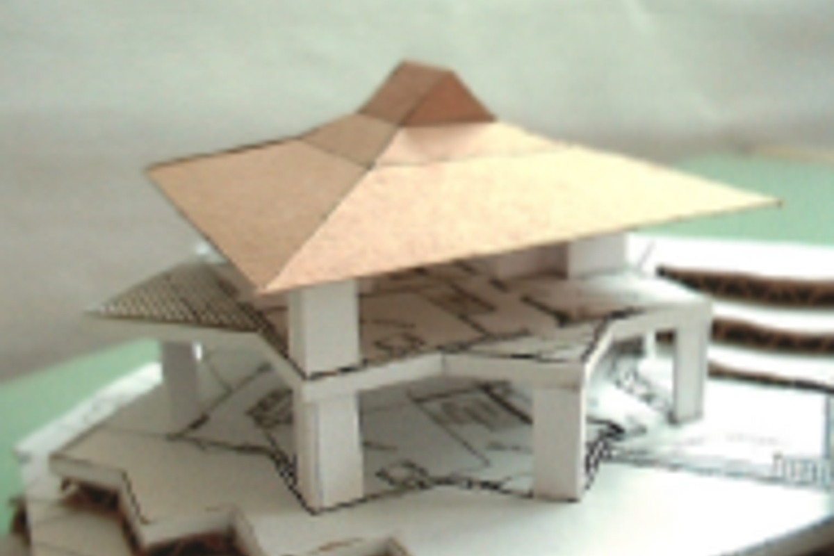 A scale architectural model representing a proposed residential structure design.