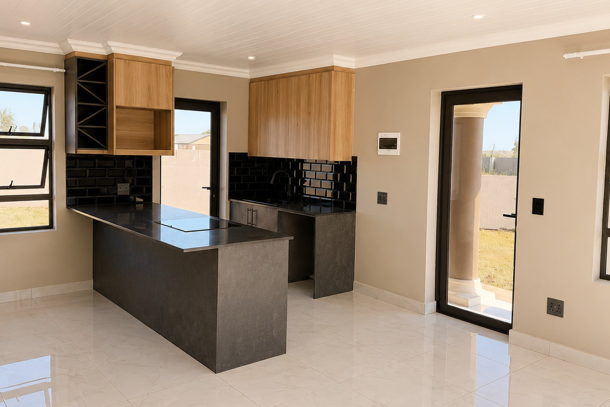 Modern kitchen featuring a central island, sleek stone countertops, wood-finish cabinetry, black subway tile backsplash, and direct access to the outdoor patio area.