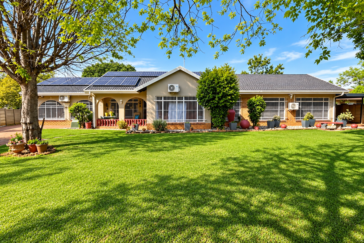 A well-maintained single-story home featuring a spacious lawn, solar panels, and secure window treatments, set within a neatly landscaped garden.