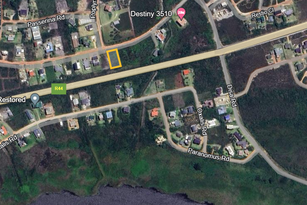 An aerial view showing the location of the vacant residential plot within the established neighborhood, highlighting its proximity to local roads and surrounding properties.