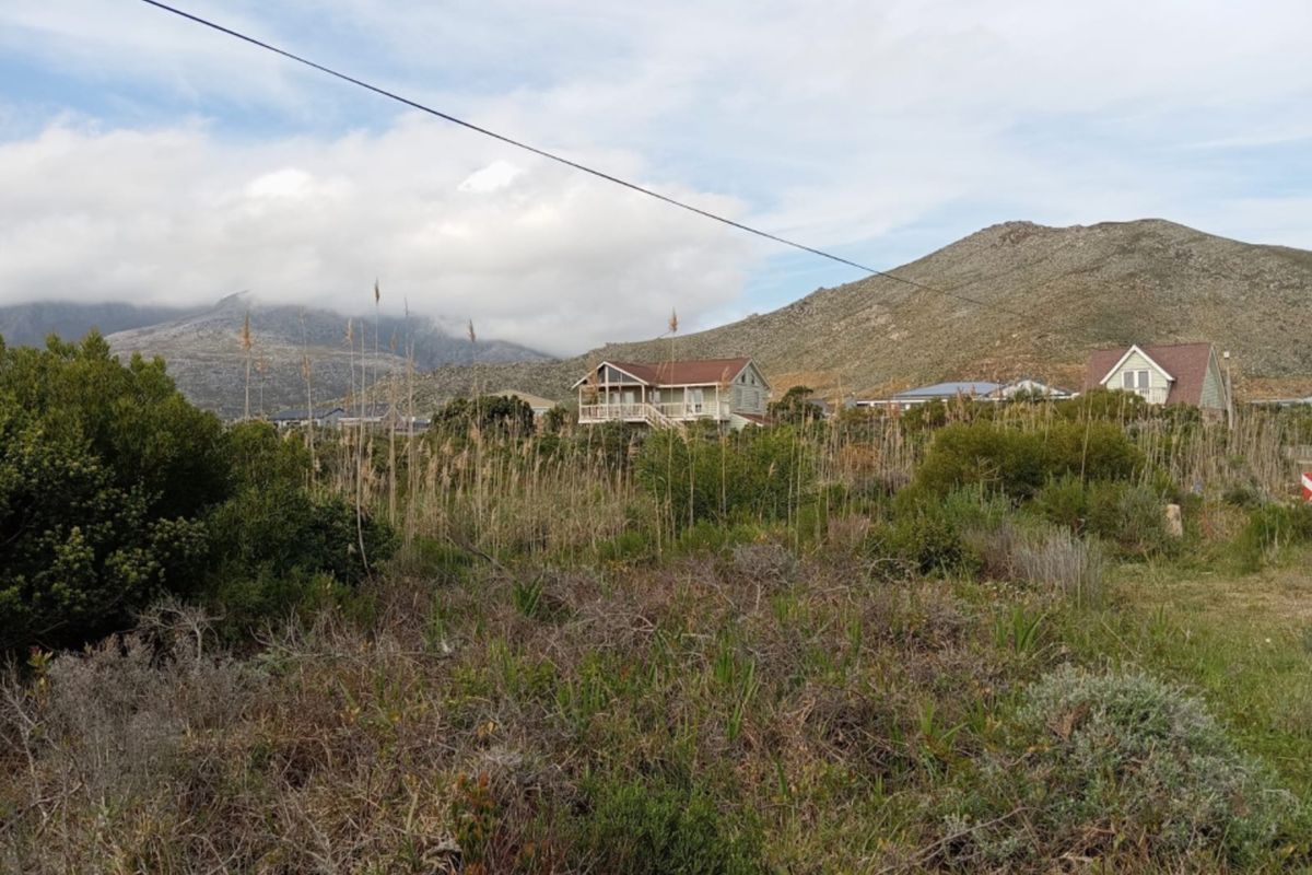 A scenic view of the surrounding landscape featuring natural vegetation and distant mountain ranges.
