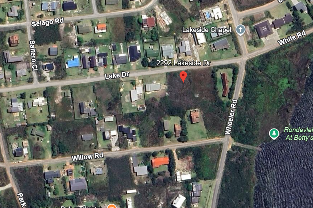 An aerial view showing the vacant residential plot located at 2292 Lakeside Drive, situated in a developed neighborhood near the lake.